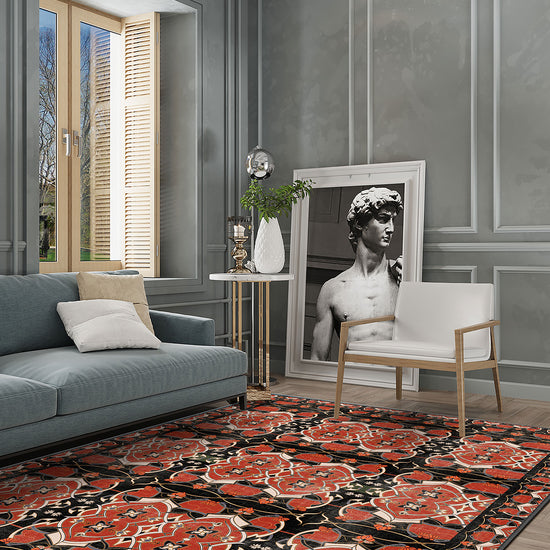 Living room with a floral rug, gray walls, and modern decor.