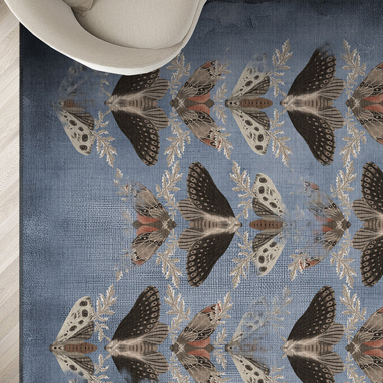 Rug with butterfly pattern on a neutral-colored floor