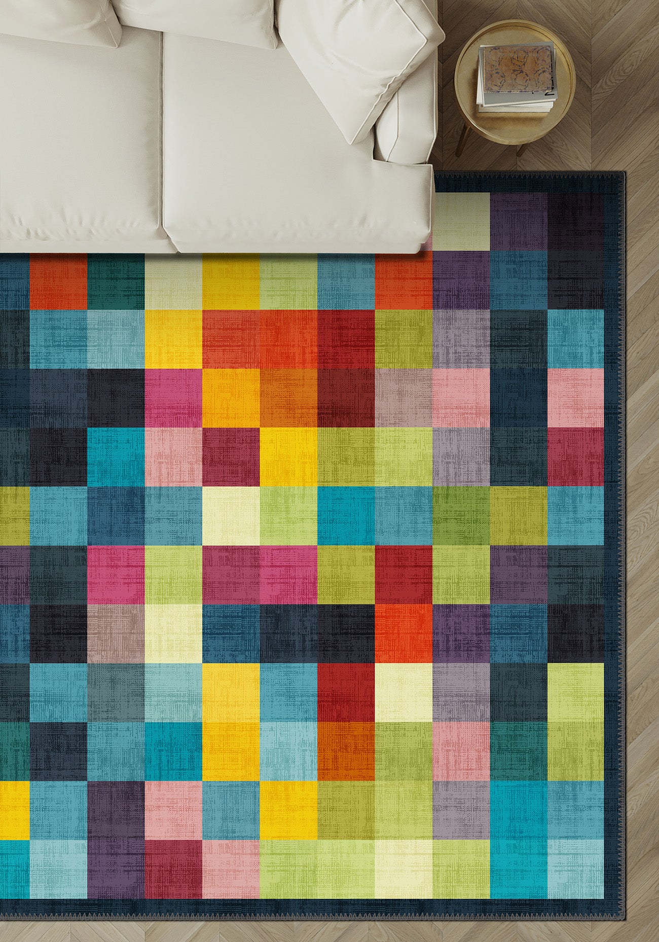 Colorful checkered rug on a wooden floor with a white couch in the background