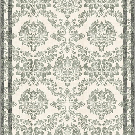 Green floral rug with damask pattern.
