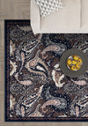 Paisley area rug in navy and brown colors.