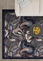 Paisley area rug in navy and brown colors.