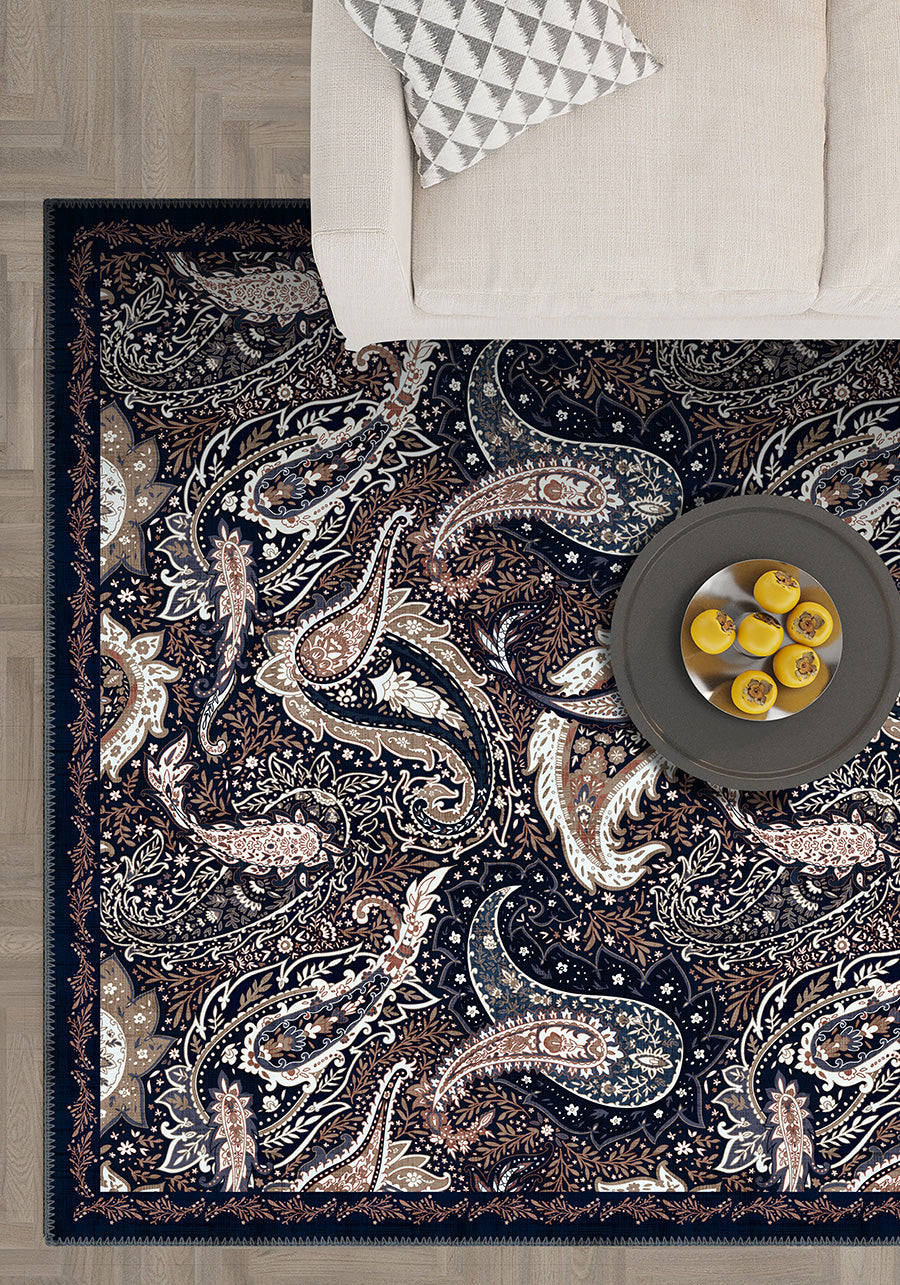Paisley area rug in navy and brown colors.