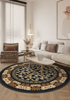 Black round rug with floral motifs.