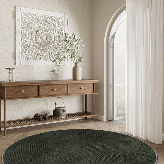 Green round rug for living room.