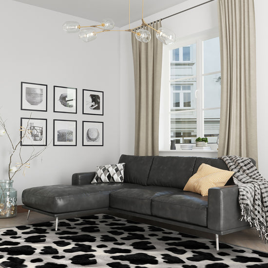cowhide rug with grey sofa
