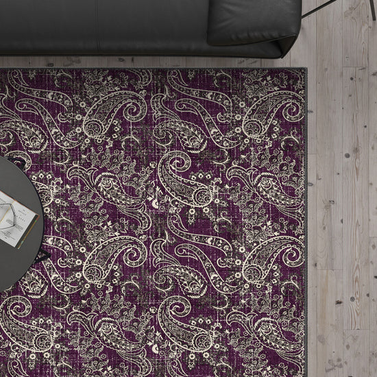 Purple paisley rug with brown details.
