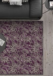 Purple paisley rug with brown details.