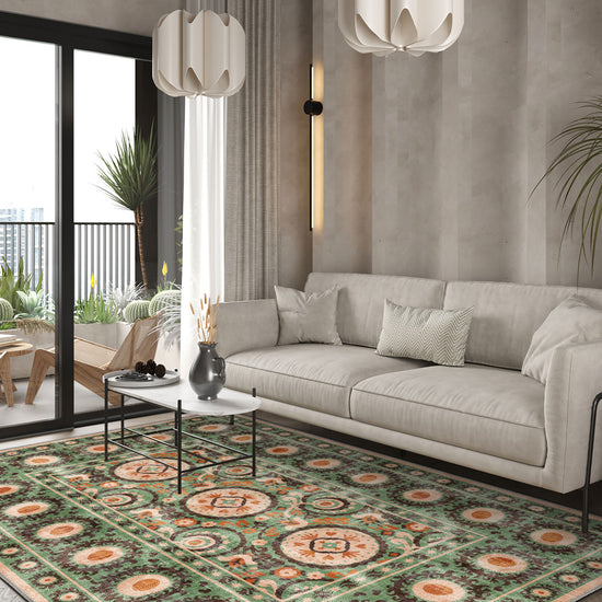 Green bohemian rug with Suzani motifs.