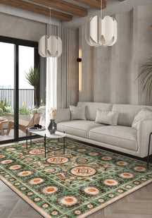 Green bohemian rug with Suzani motifs.
