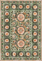 Green suzani rug with ethnic motifs.