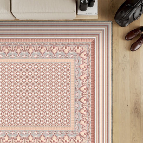 Geometric pink rug for living room.