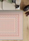 Geometric pink rug for living room.