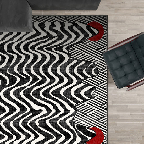 Black and white striped rug with red dots.