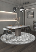 Black and white round rug for dining room.