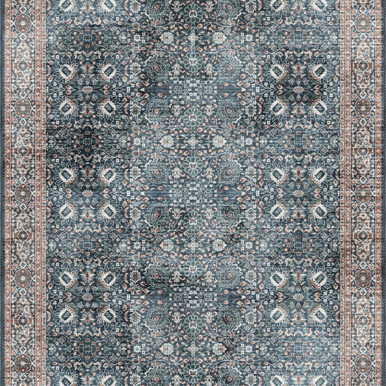 Navy rug with intricate pattern.